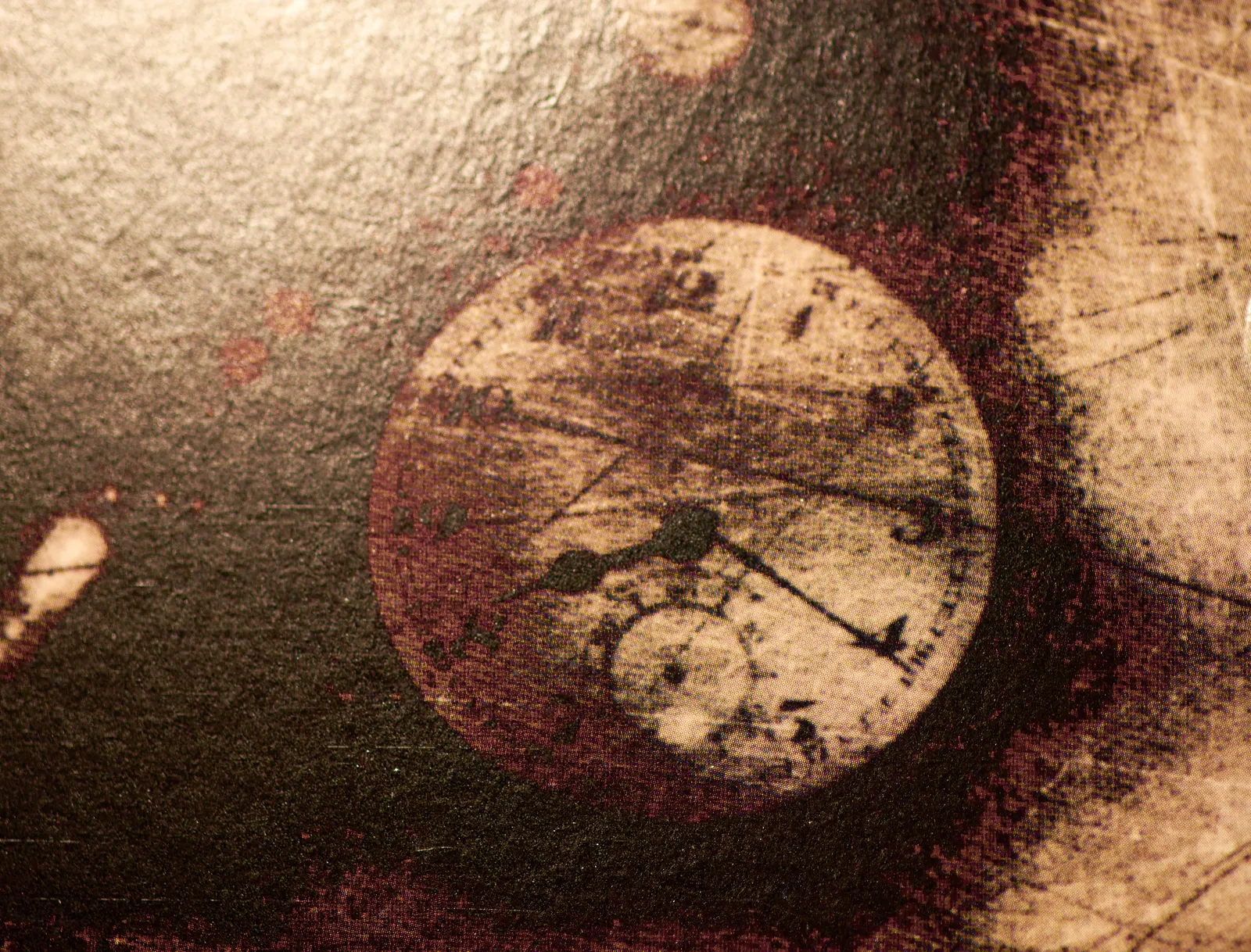 A detail from a Ministry album. A clock can be seen that points at 20 past eight.