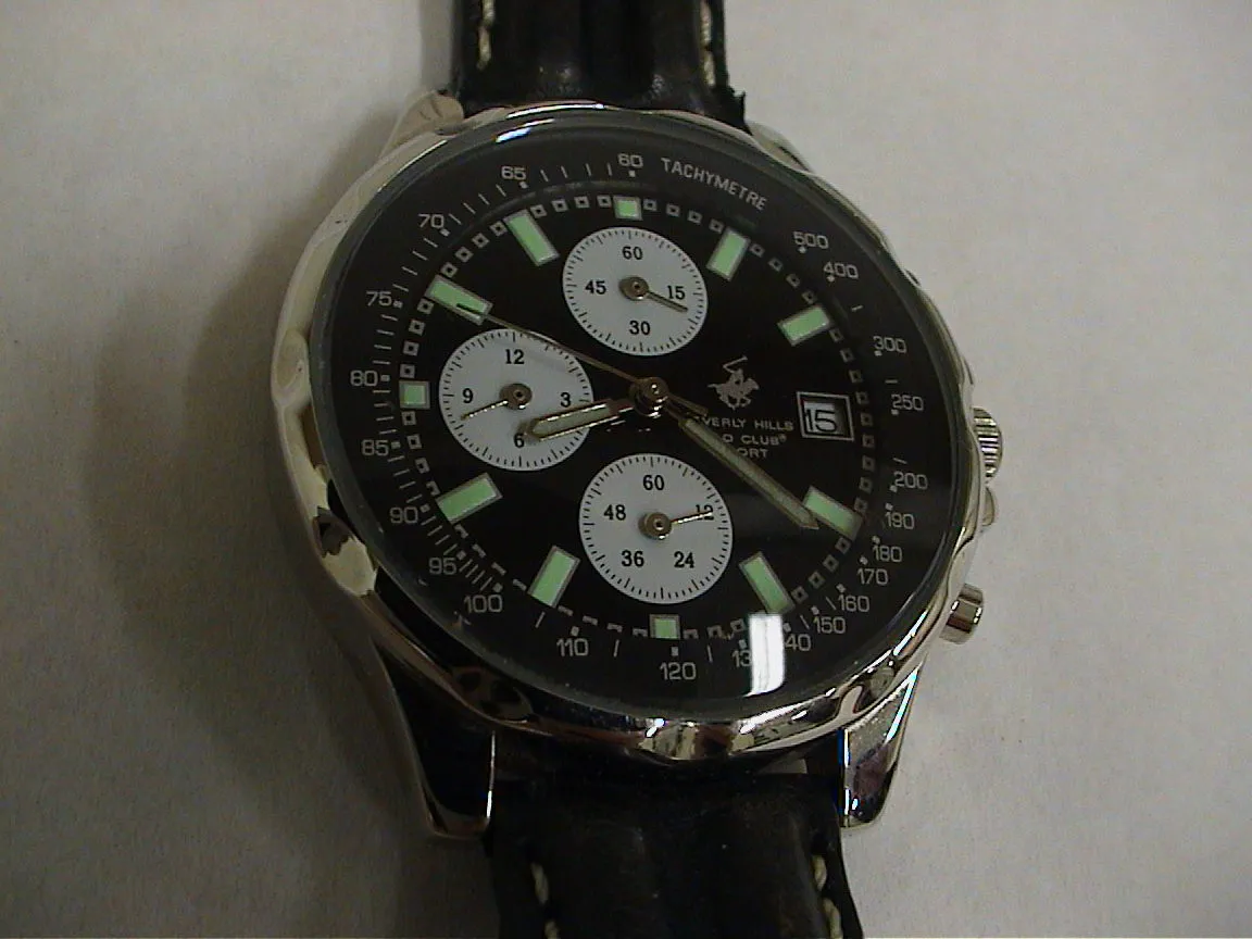 A watch with many different types of dials also pionts at 21 past eight.
