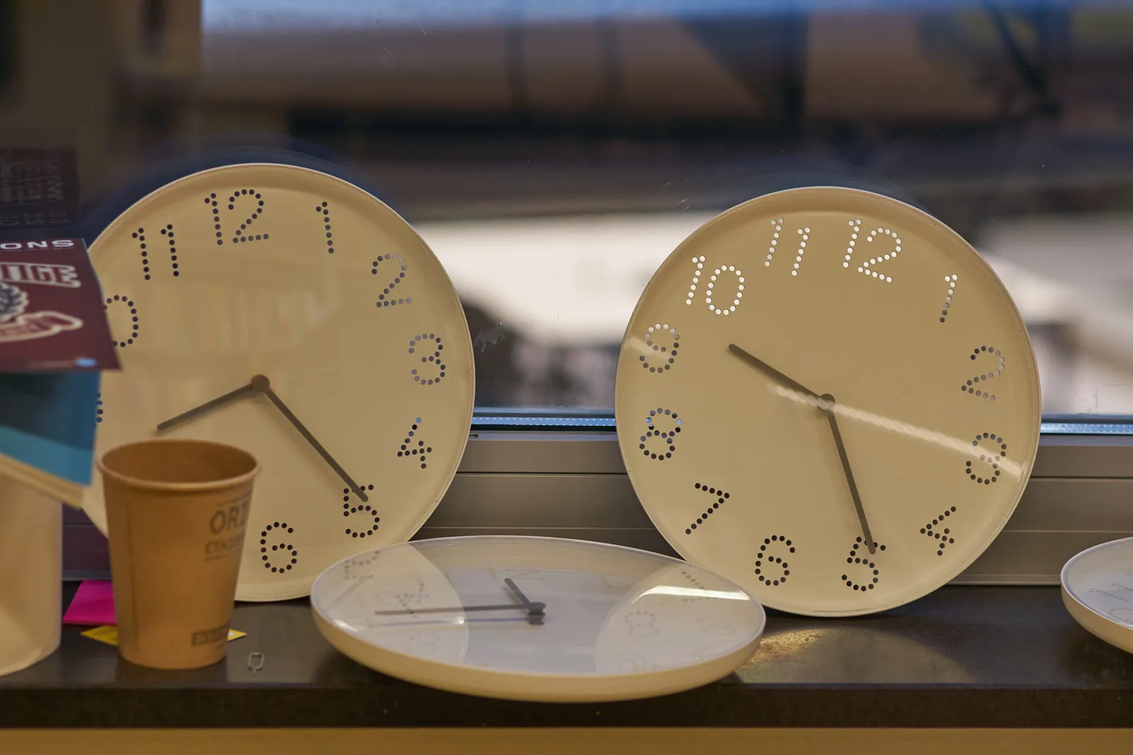 The are three clocks on this picture. On one of them it is 08:25, which it is right here, right now. On another clock is 9:25, which it is somewhere else, and the third one points at a quarter to twelve, which it is not.