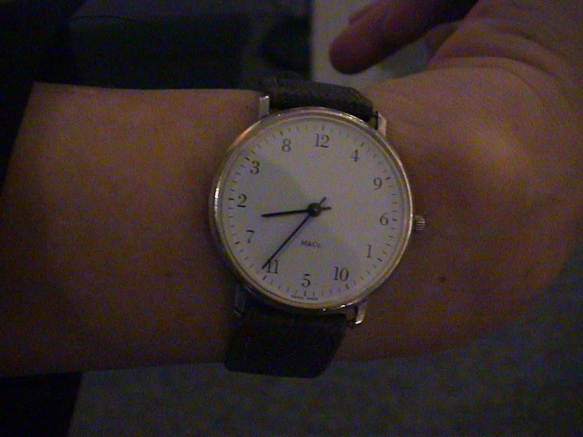 Even though the numbers on this wrist watch ar scrambled, it still points at 36 past eight.