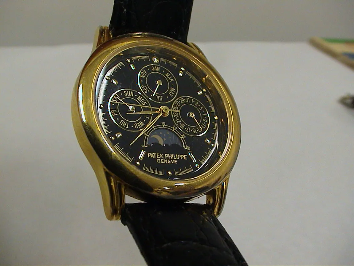A clock with many more dials than just those showing the time, points at 37 past eight.