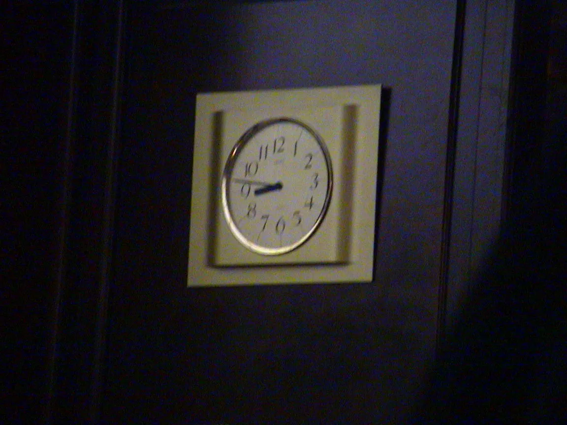 This clock, that’s been built a bit shoddily into a wall, points at thirteen to nine.