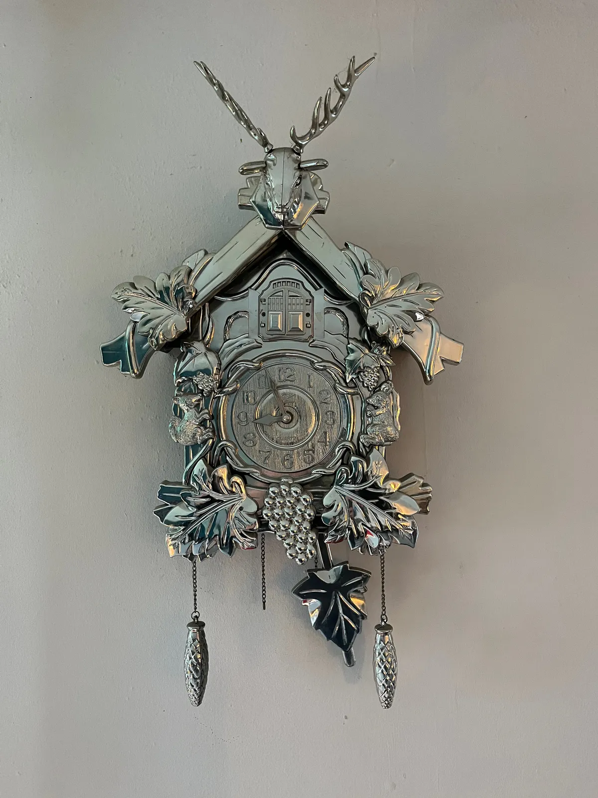 In incredibly shiny blingbling cuckoo’s clock. It points at approximately 4 minutes to 9.