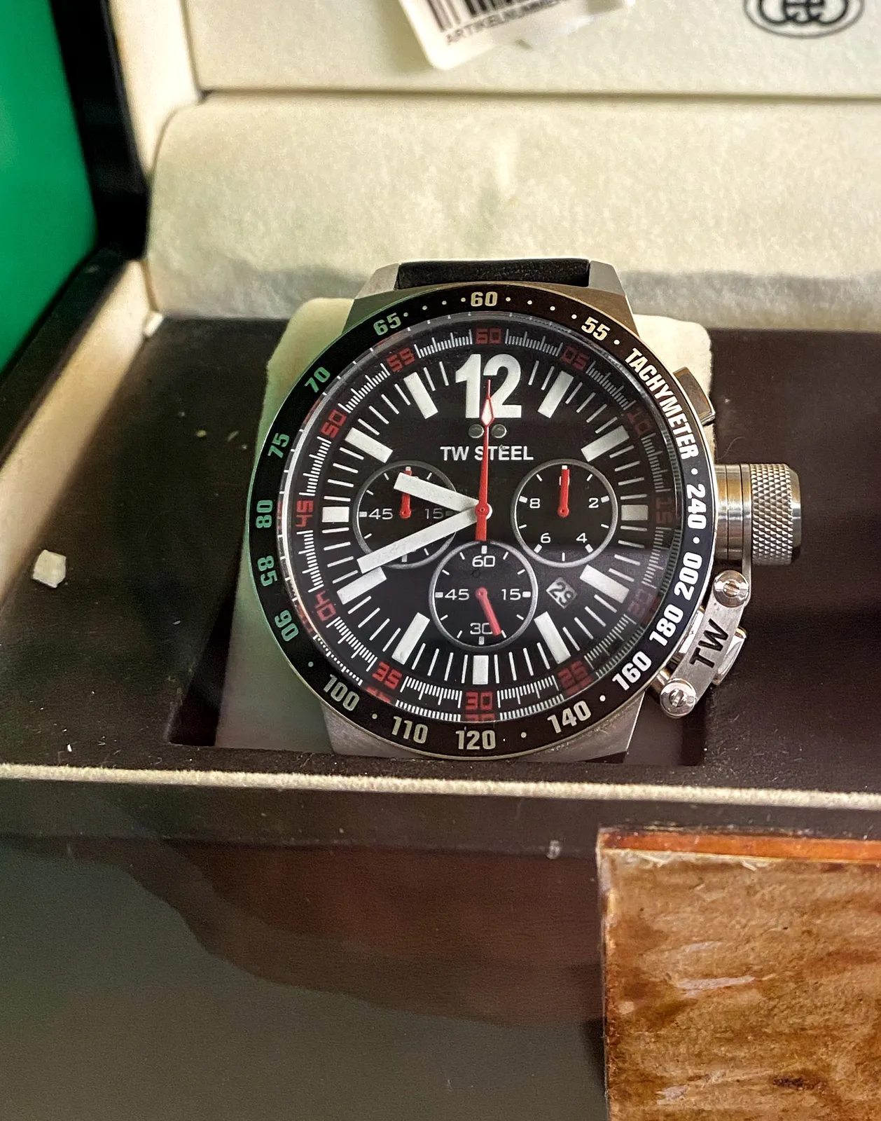 A watch with lots of contrast. It points at 19 minutes to 10.