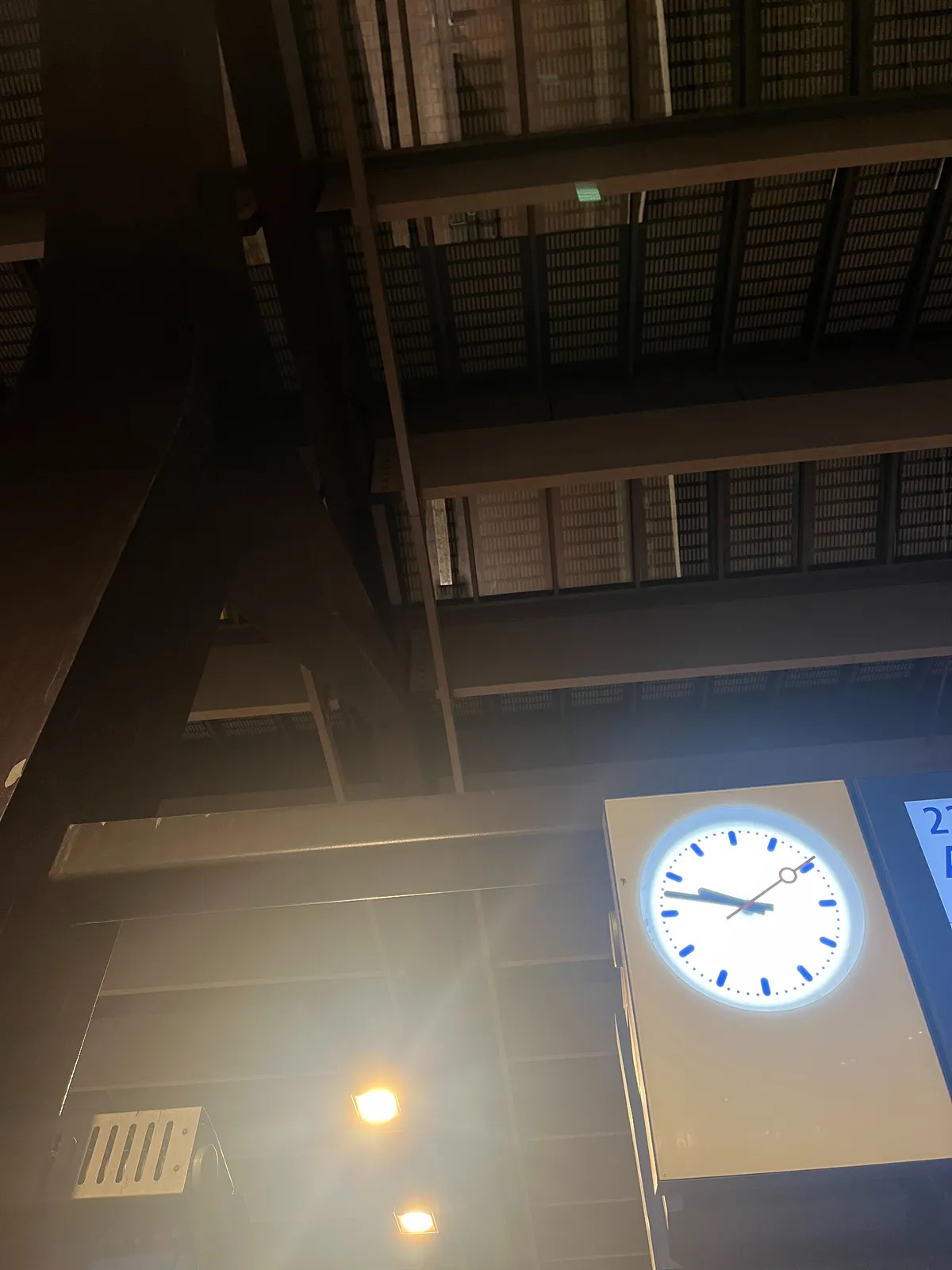 A ceiling that’s not necessarily designed to look at, and a clock that points at 13 minutes to 10.
