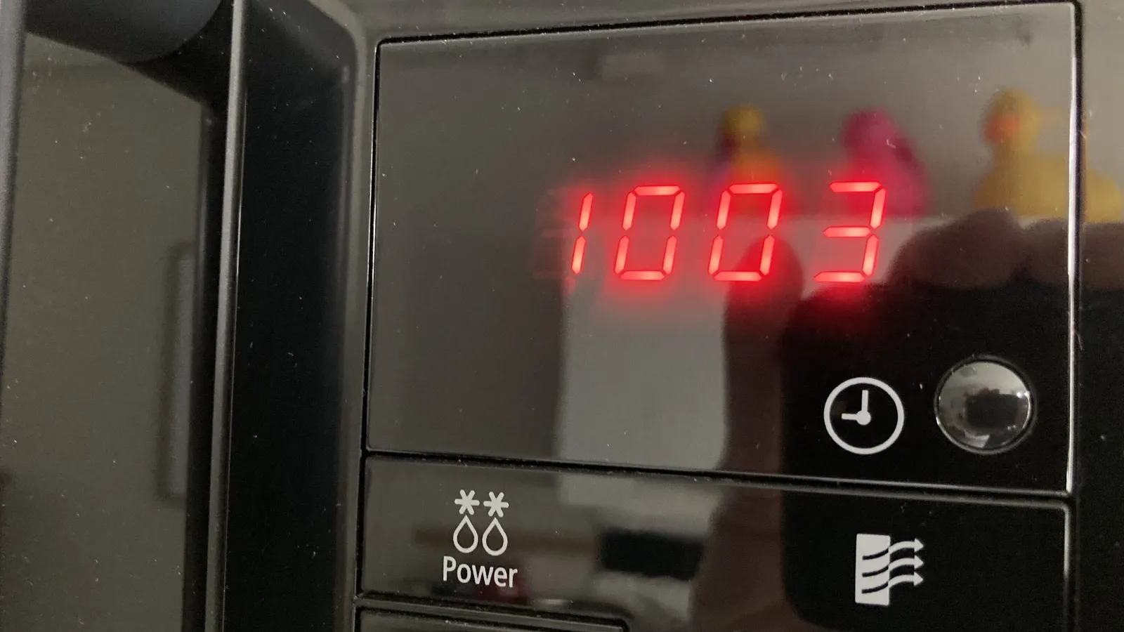 Red digits showing the time as 10:03.