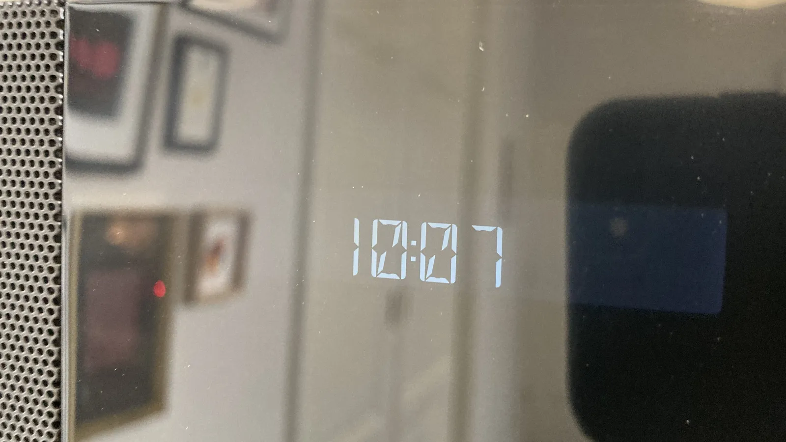 A shiny digital display shows the time as 10:07. 