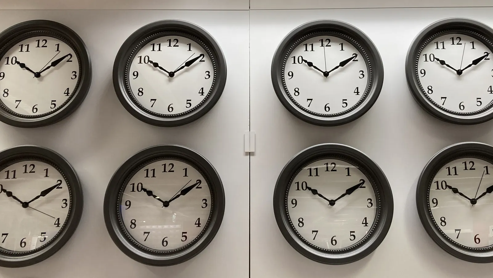 Eight clocks, all the same, that all point at approximately 10 past 10.