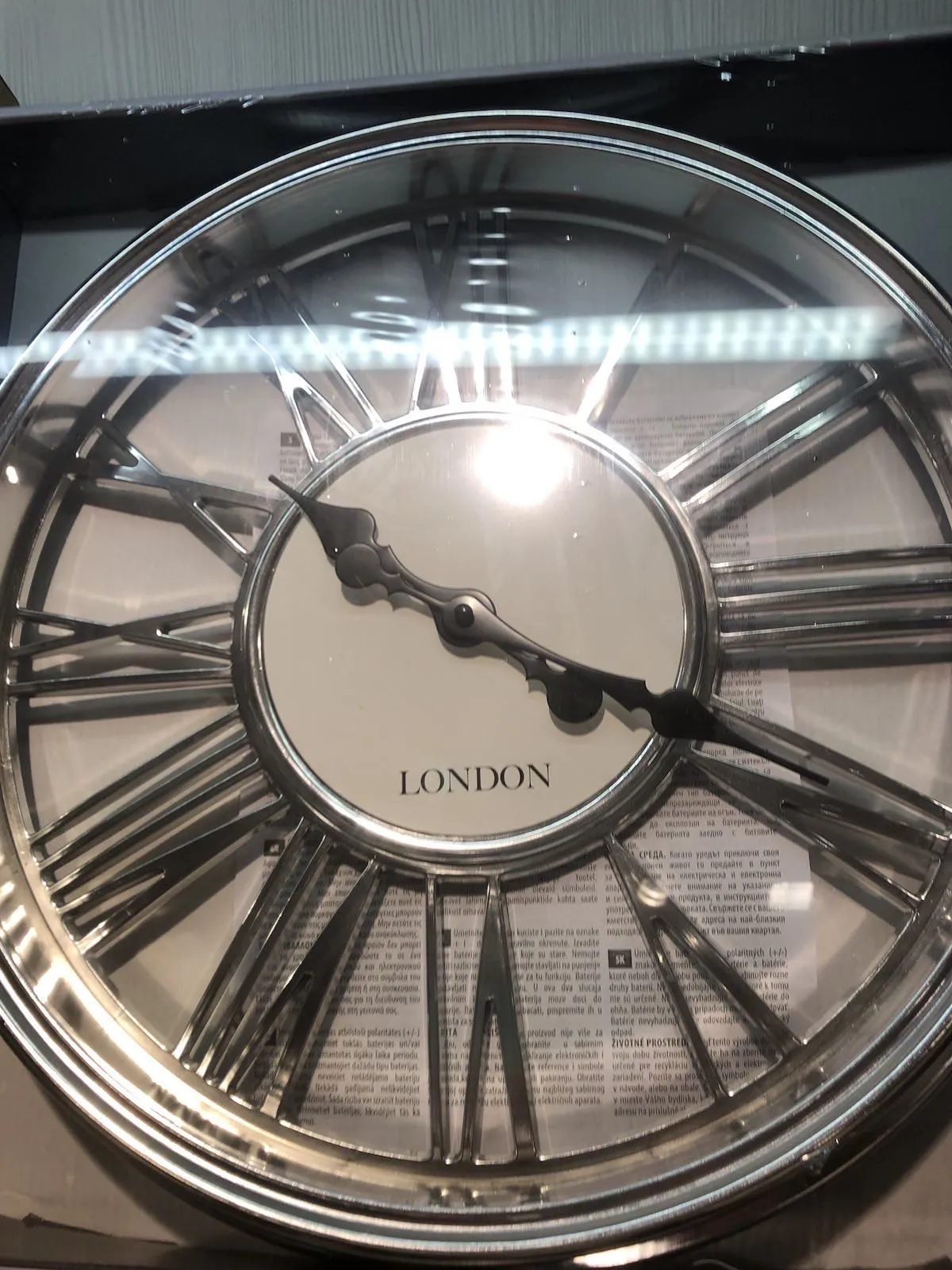 A boxed clock points at 19 past ten.