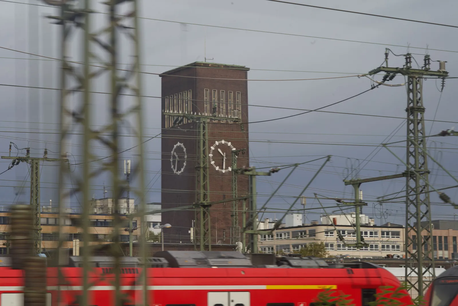 The train is leaving Düsseldorf station. You can see the large tower of Düsseldorf Hauptbahnhof with its enormous clock. It points at half past 10.