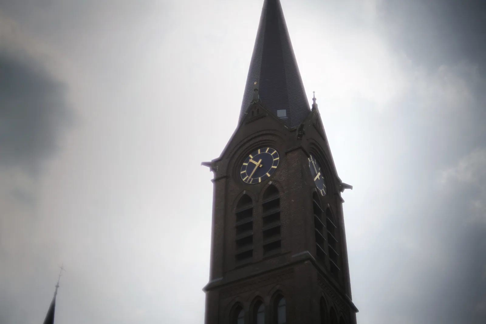 The clock on this church tower points at 10:36