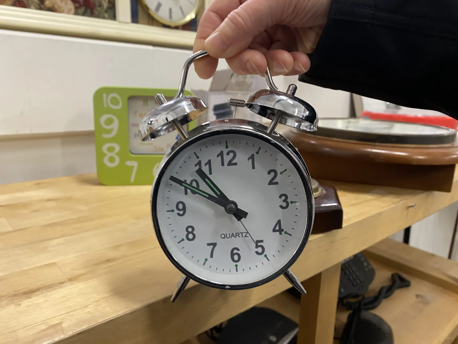 On this alarm clock it is 10 minutes to eleven. 
