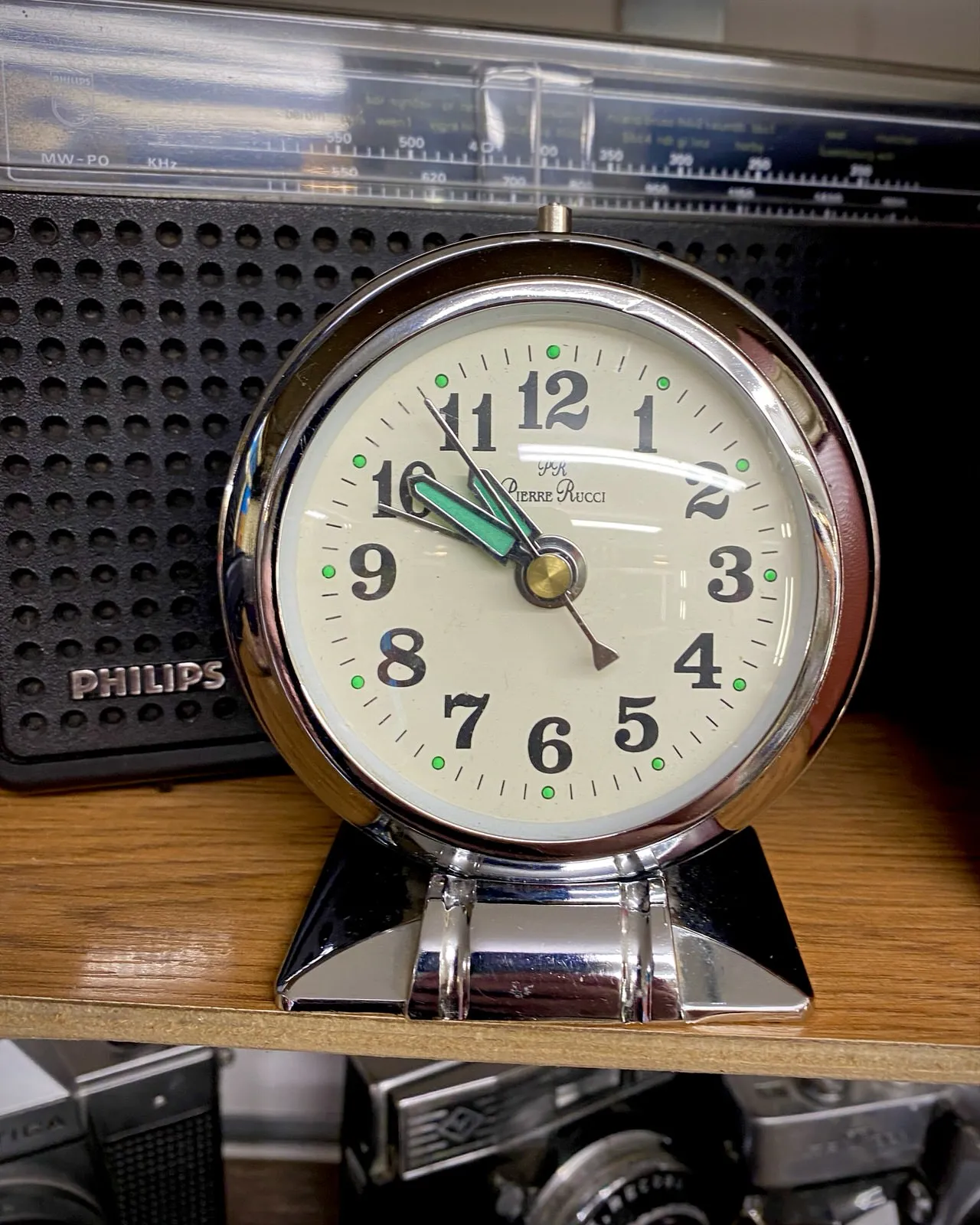 Between all this stuff in a thrift shop there’s a clock that points at 9 minutes to 11.