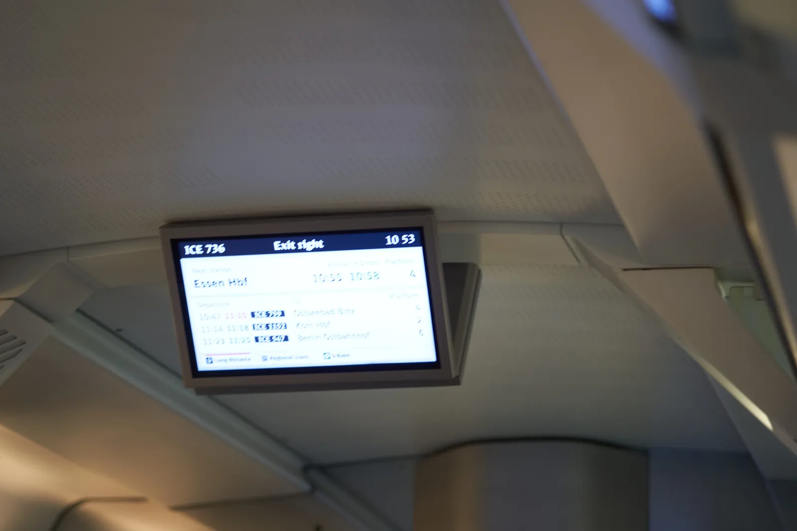 The display inside the ICE 735 indicates that the exit in Essen Hauptbahnhof will be on the right. It also shows the time as 7 miniutes to 11.
