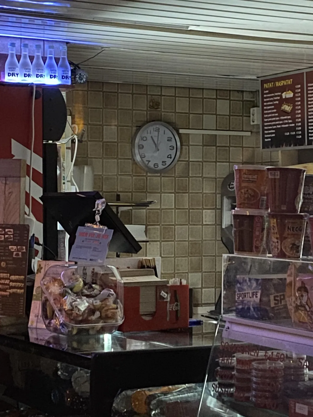 This clock in a snackbar points at one minute past 11.