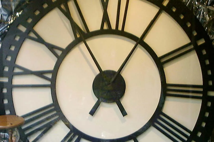On this more than full screen clock with latin numerals it is five past eleven