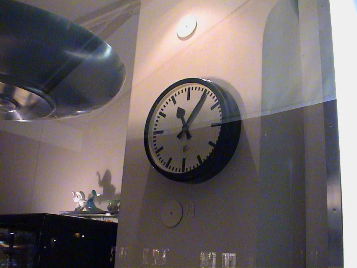 This large wall clock points at six past 11.