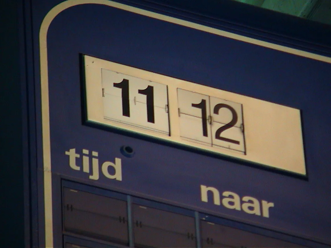 A clock says it is 11:12