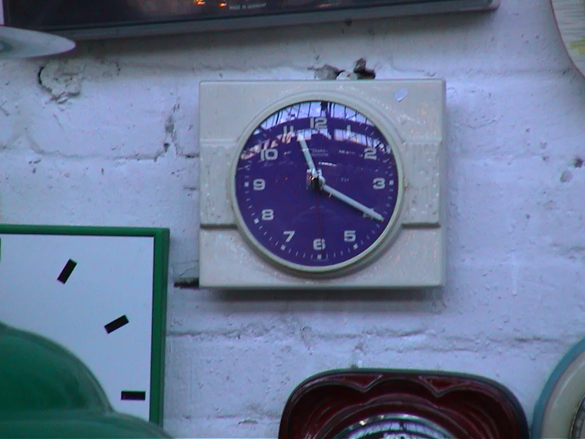 A purple clock points at 20 past 11.