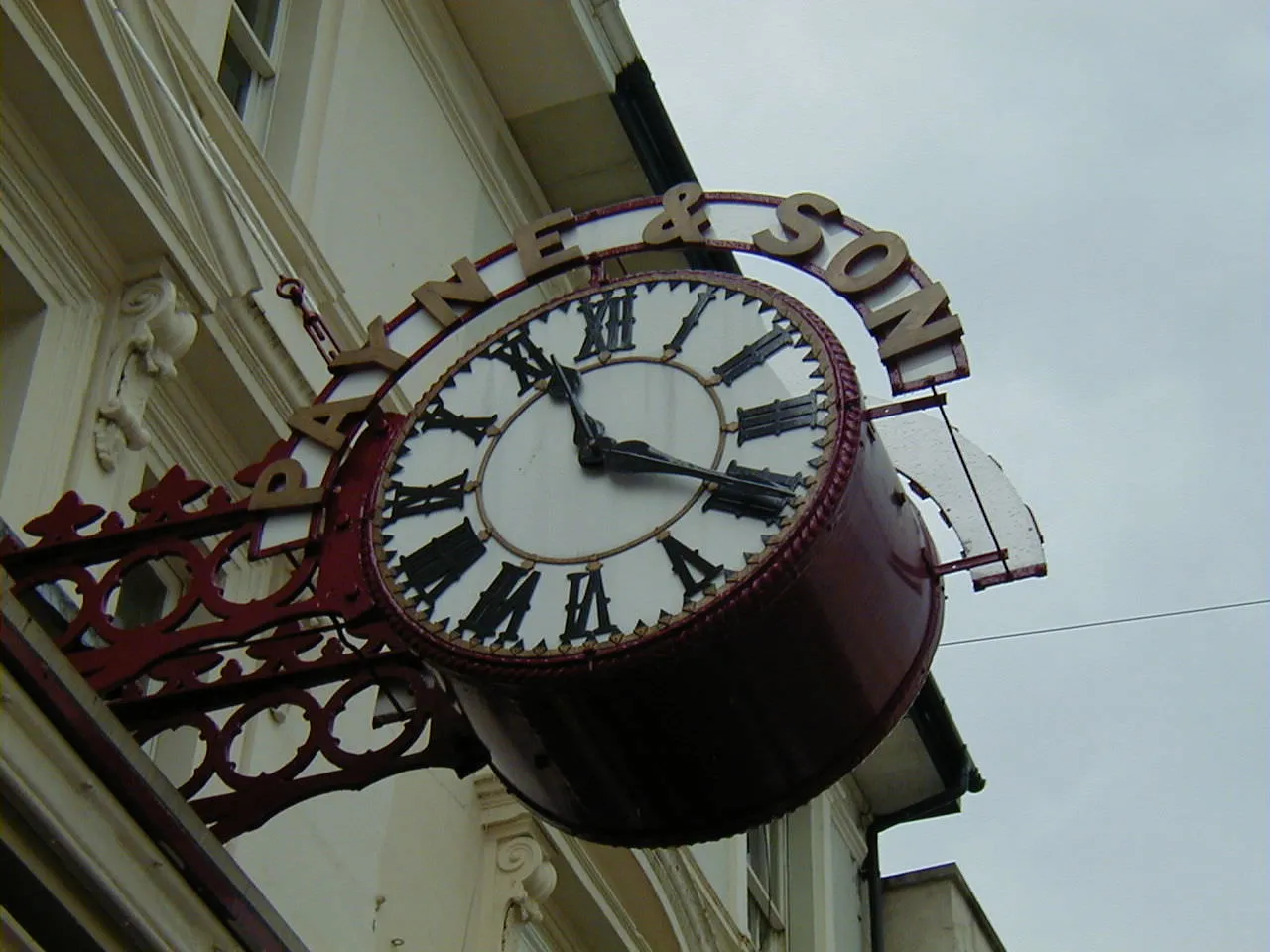 This large iron Payne & Son clock points at twenty past eleven.