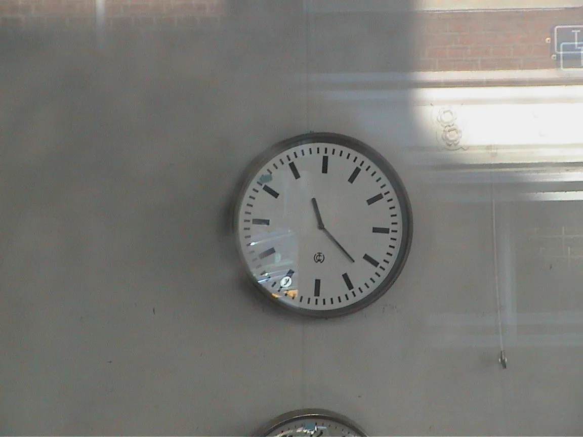 It is 11:22 on this wall clock. 