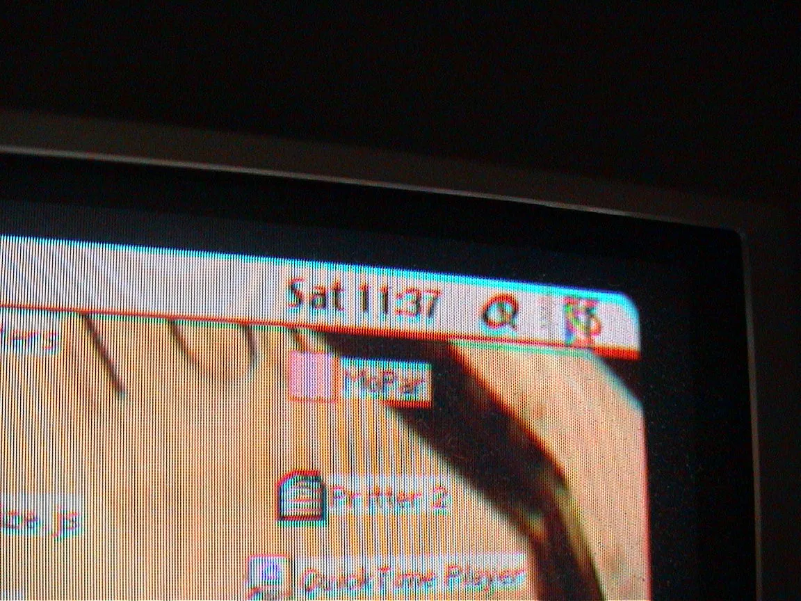 The time on the computer screen is 11:37