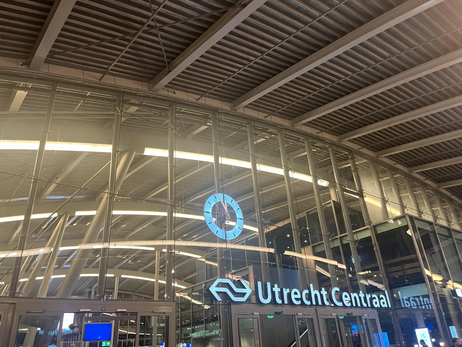 The enormous clock on the facade of the Utrecht Central Station points at approximately 3 minutes to 12.