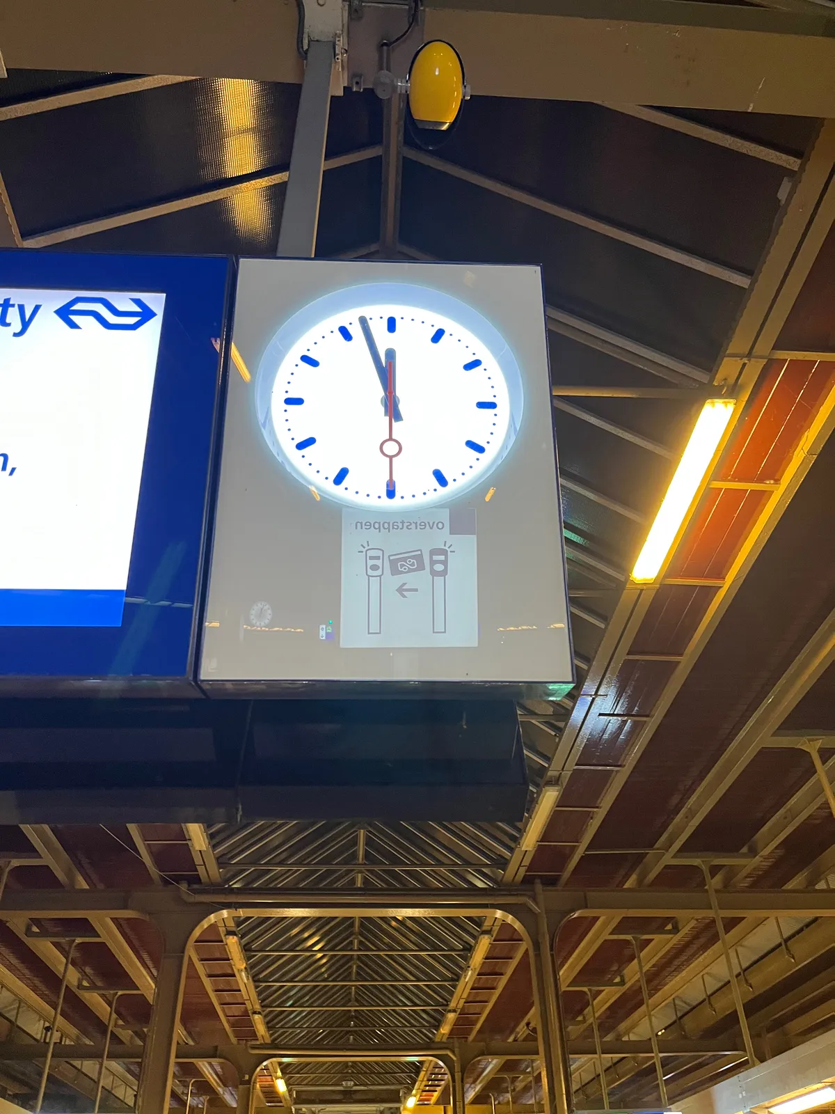 It is three minutes before twelve on this station clock.