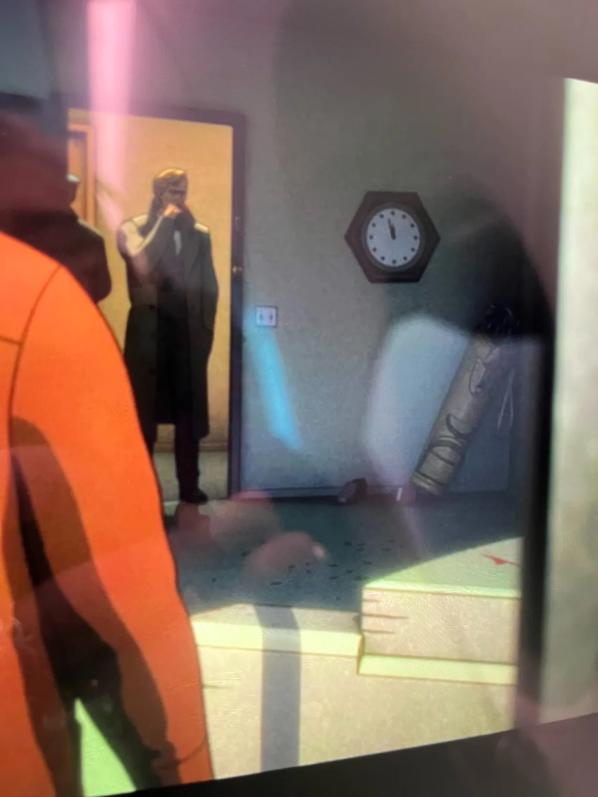 A still from a cartoon. There’s a clock in this scene. It points at 3 minutes to 12.