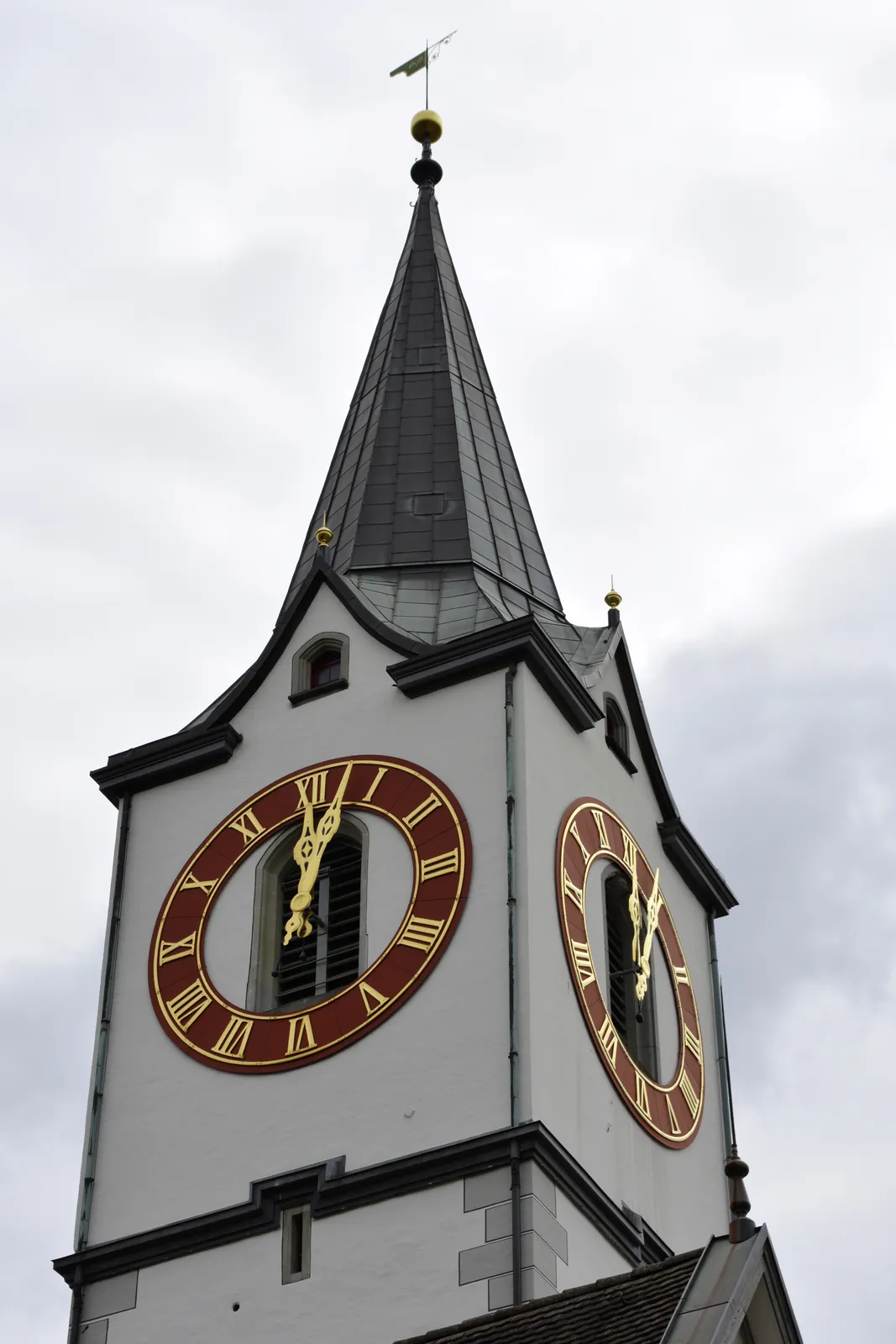 According to the clock on the tower of the St. Mangen church in St Gallen it is two minutes past twelve.