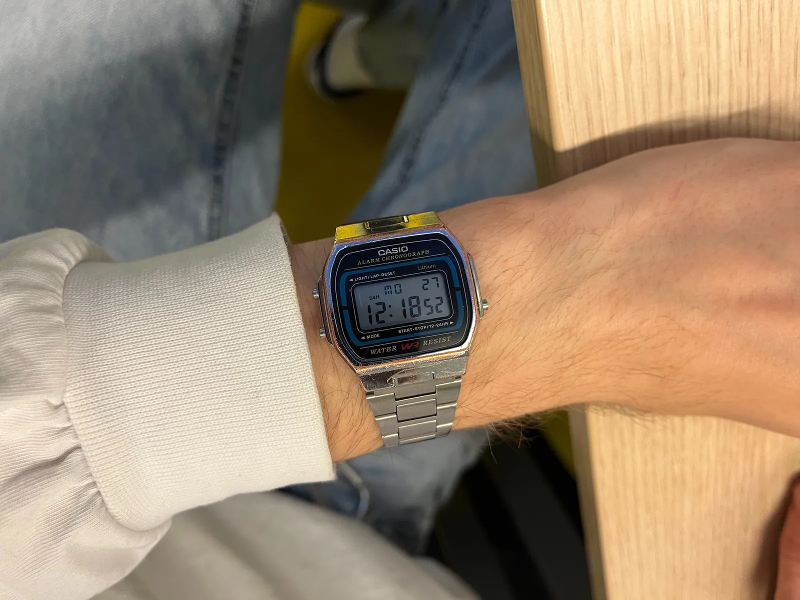 A Casio Alarm Chronograph on someone’s wrist. It displays the time as 12:18.