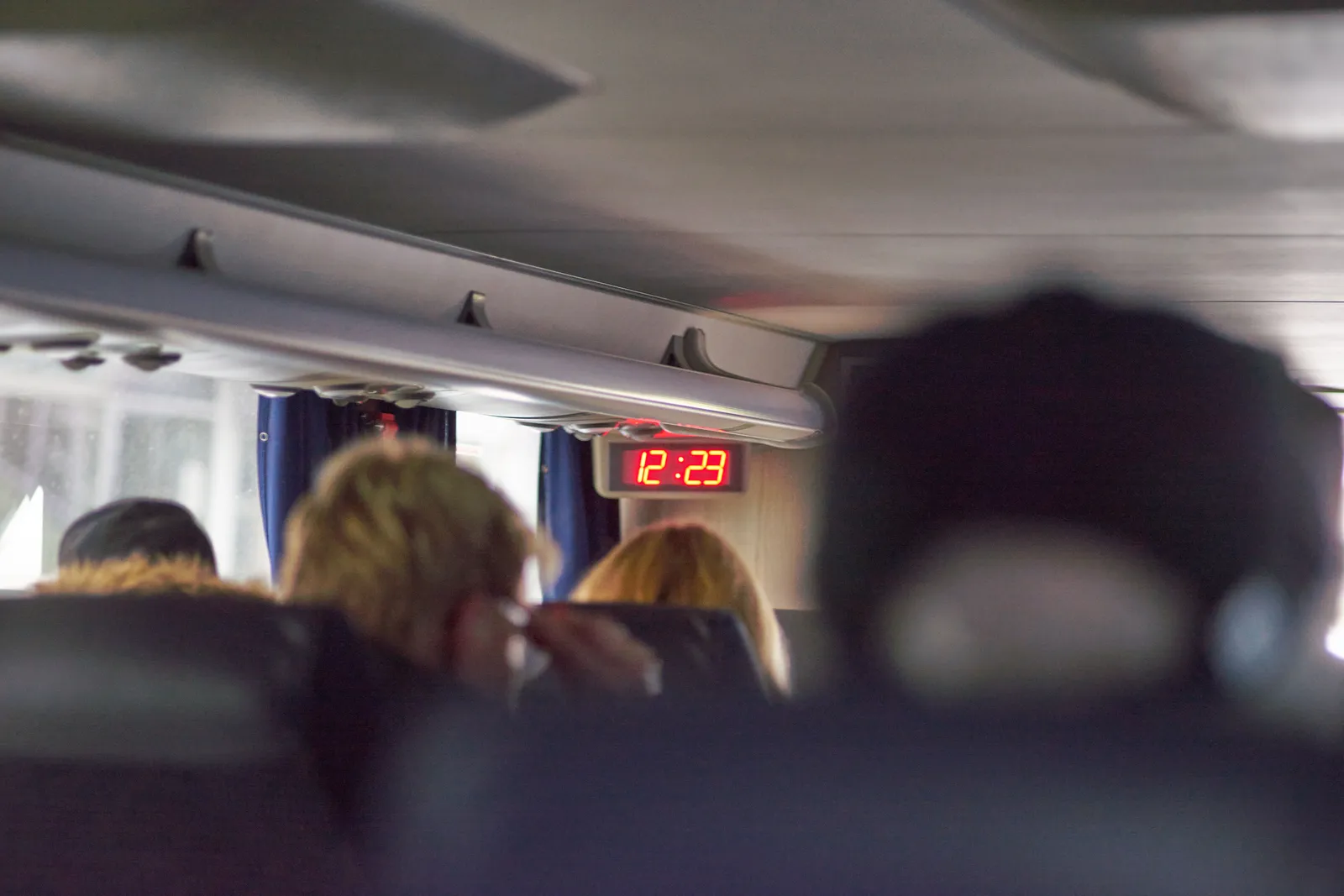 On this digital clock inside a bus it is 12:23.