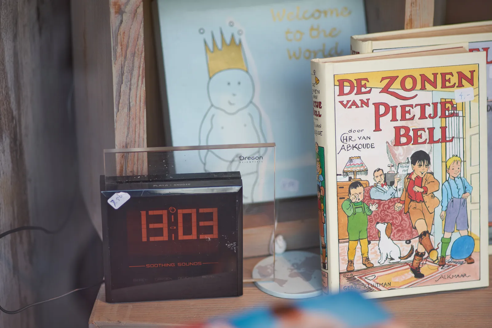 The display on a digital clock in a thrift shop shows it’s 13:03