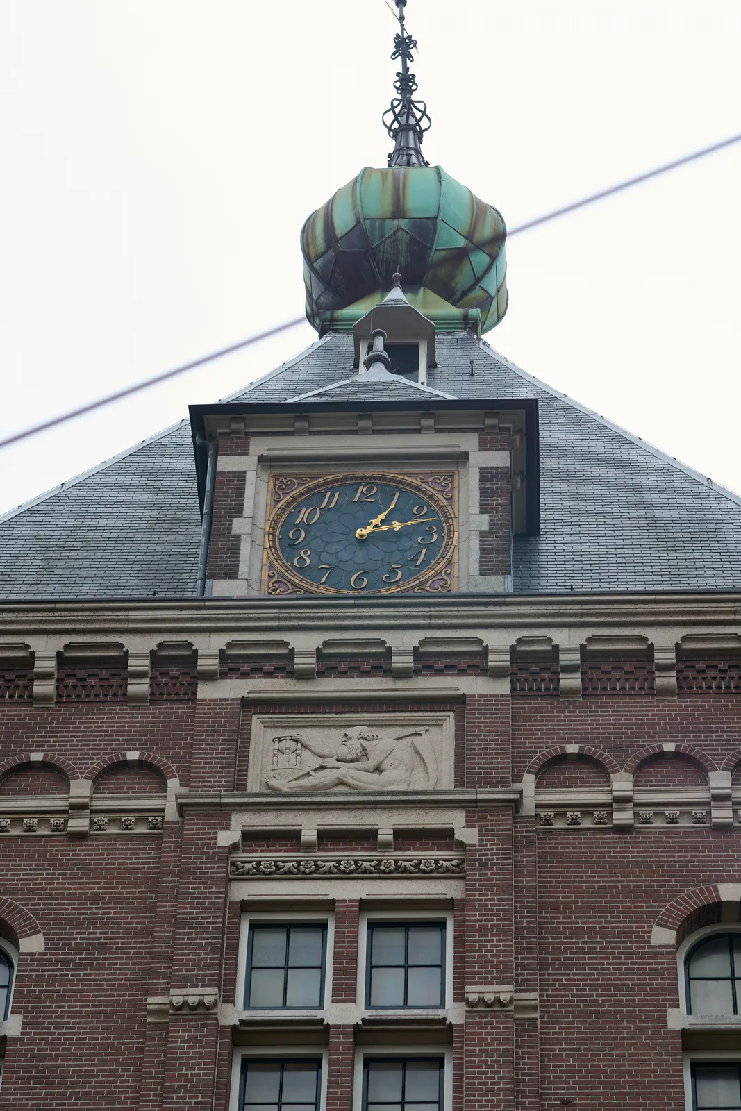 It is 14 past one on this clock on the Tropenmuseum in Amsterdam. 