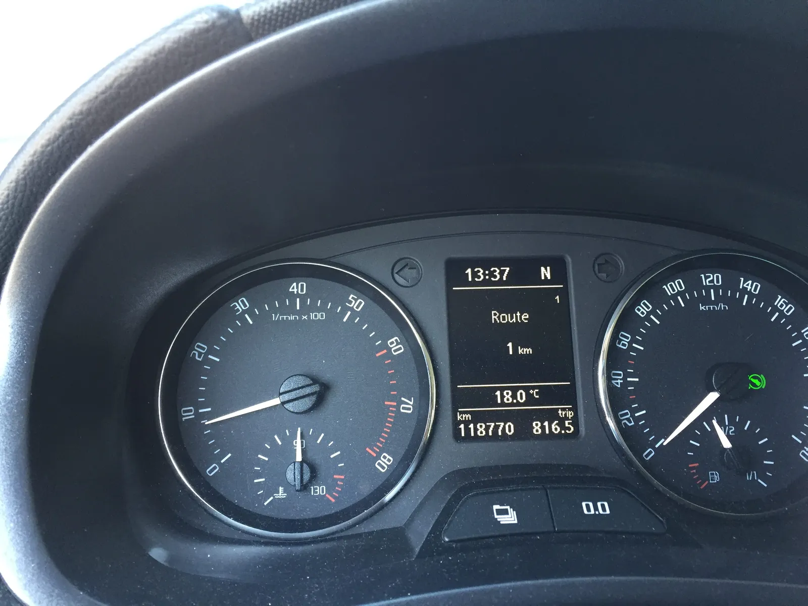 Quite some dials, and quite some digital numbers on this dashboard of a car. On of the numbers tells the time. It is 13:37
