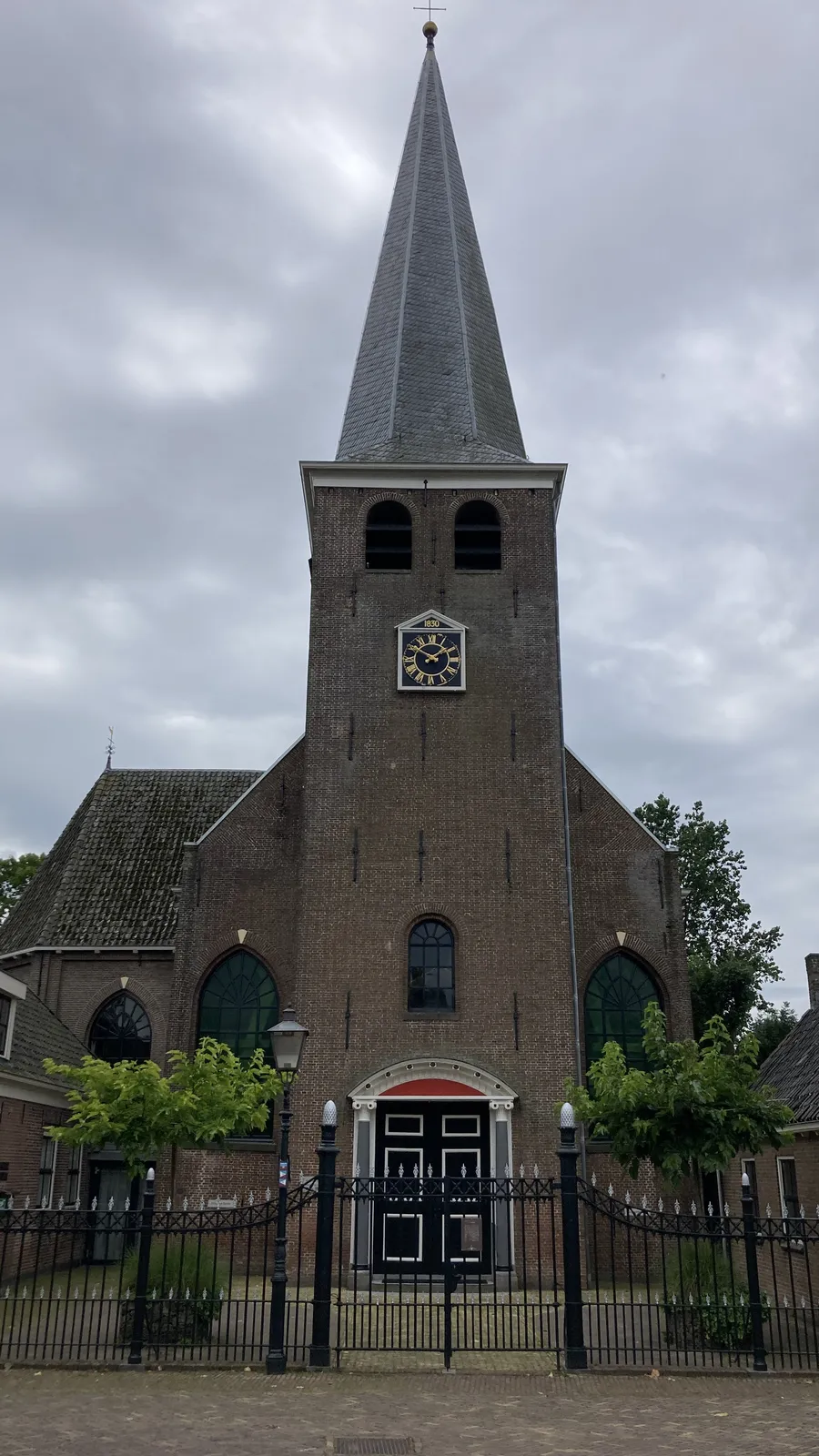 A Dutch town church from 1830. There’s a clock on its tower that points at 10 minutes to 2.