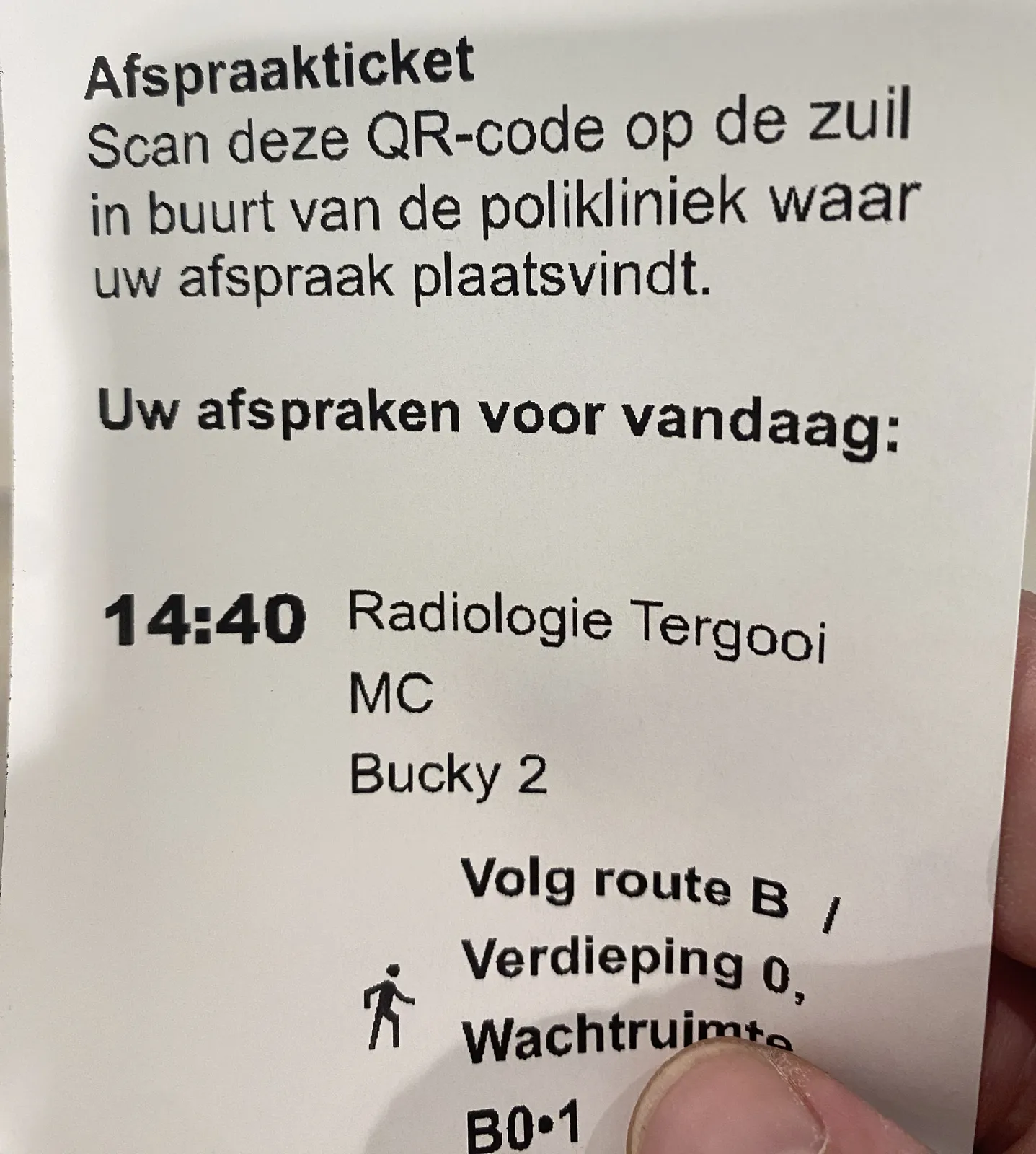 A ticket for an appointment at a hospital. The patient should scan the — not visible — QR code on this ticket at a device close to where the appointment is. It also says that the appointment is at radiology. There’s a route description, and some random words: MC and Bucky 2. There’s also a timestamp printed on it, which says 14:40.