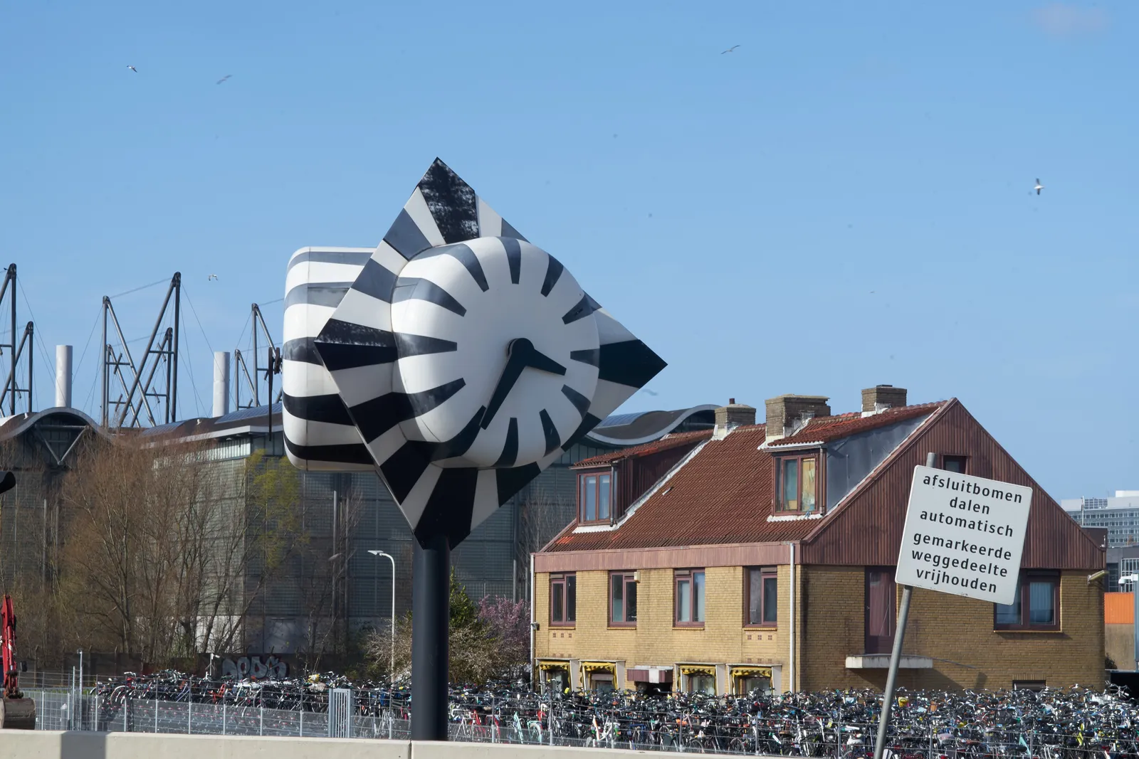 On this bulbous zebra clock it is 35 past three.