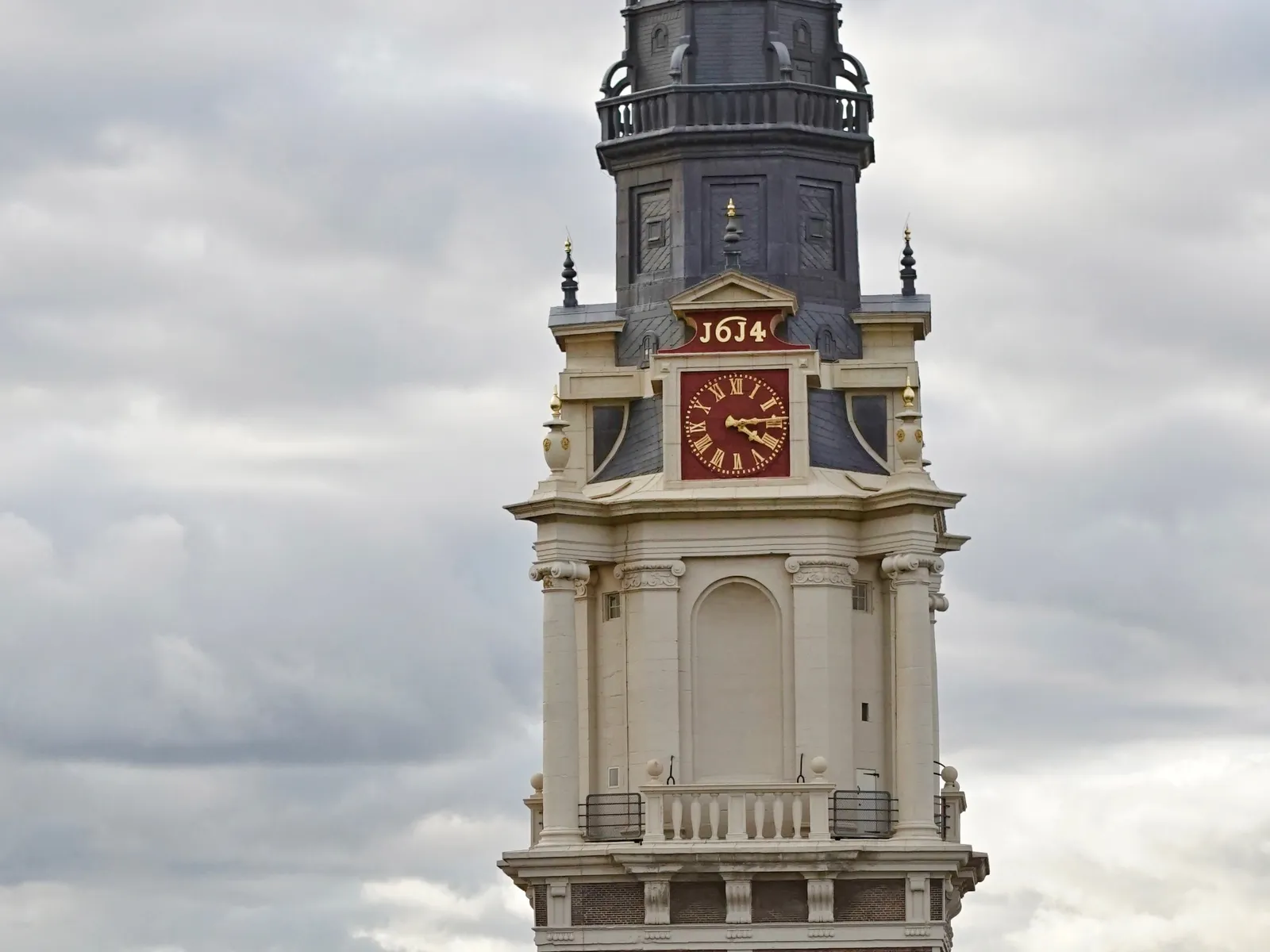 The digits above this old church clock say 1614, which is probably the year it’s been built. The clock itself points at 16:14 as well.