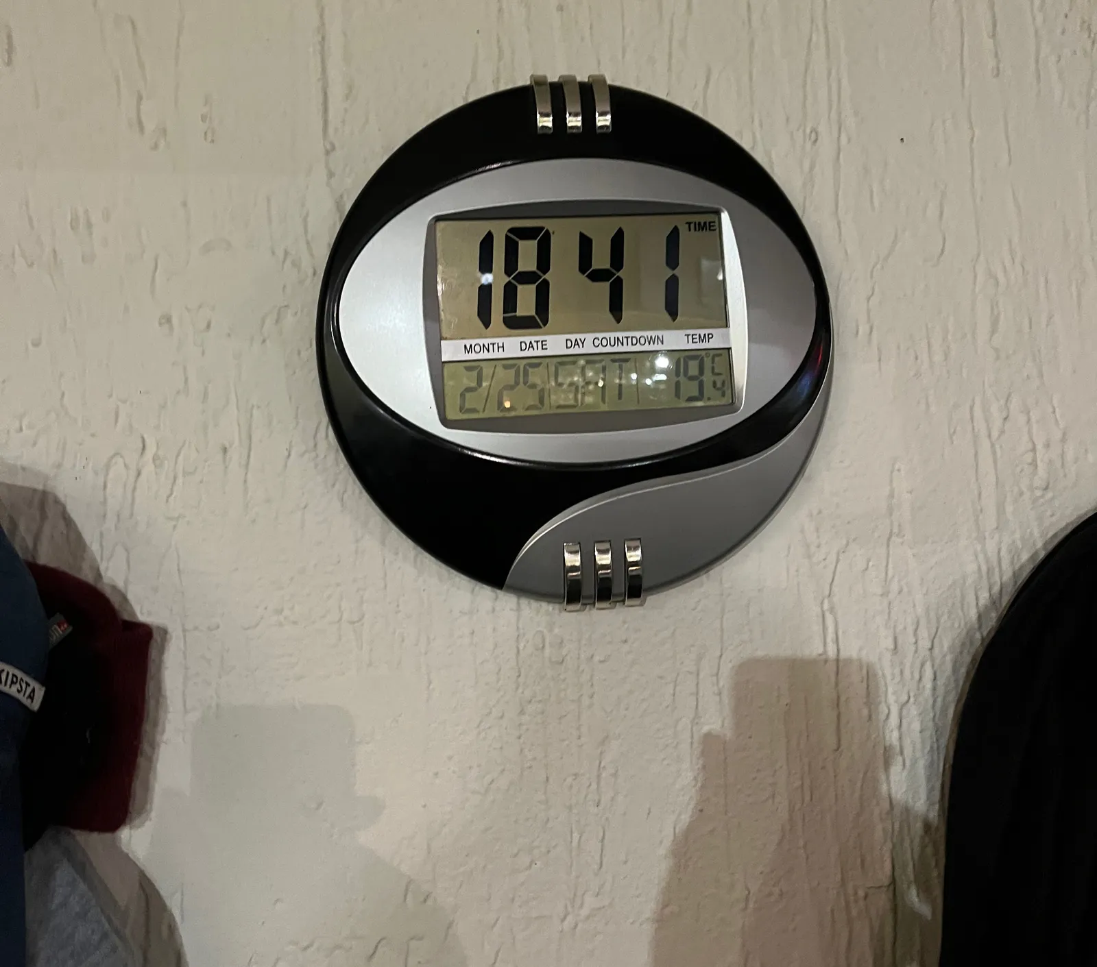 A digital clock says is 18:41