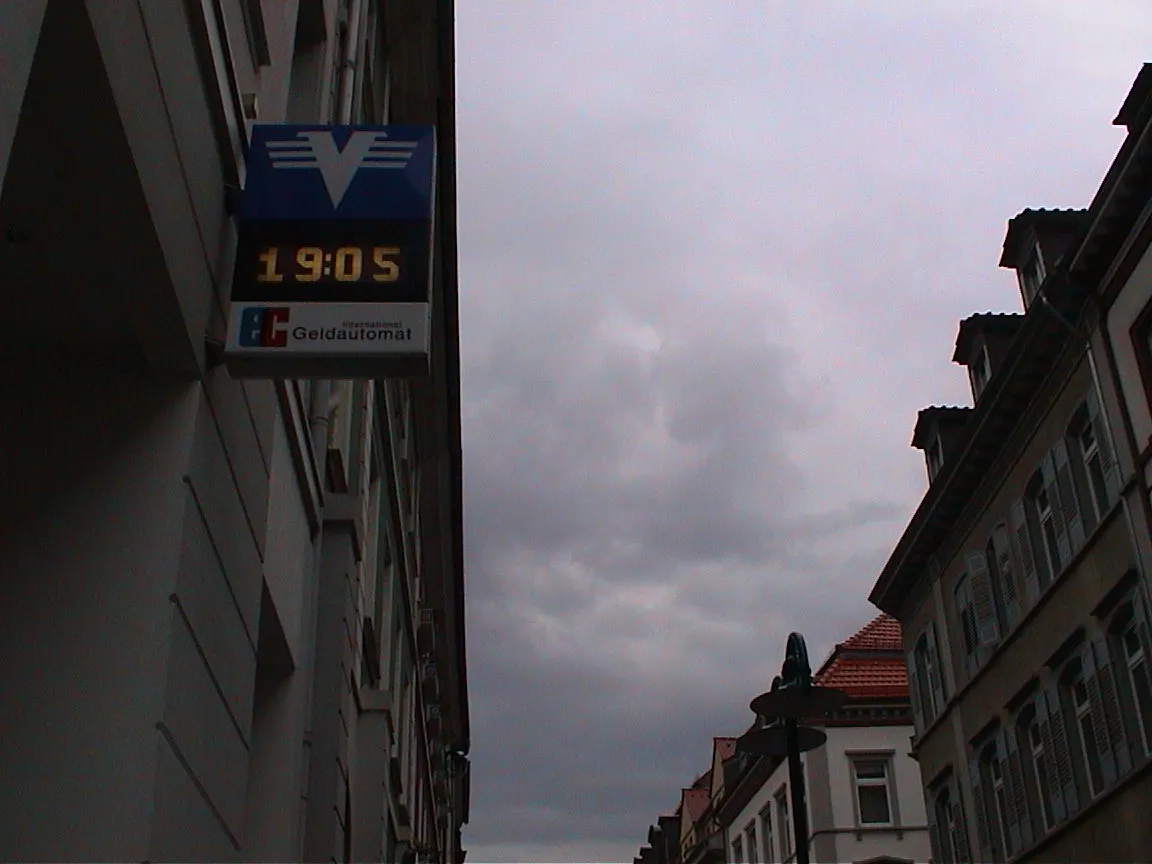 The clock in this signt that points at a Geldautomat says it is 19:05