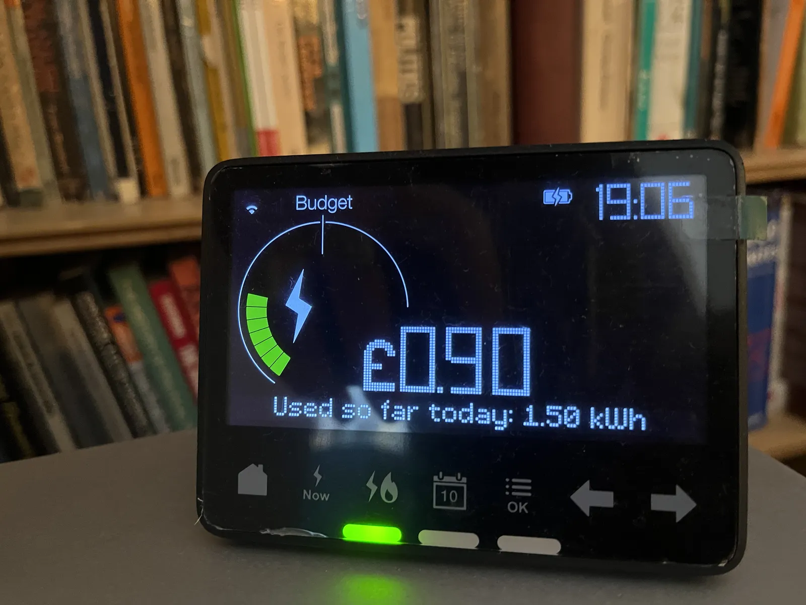 Some sort of black device with a digital display, tells us, among other things, that it is 19:06