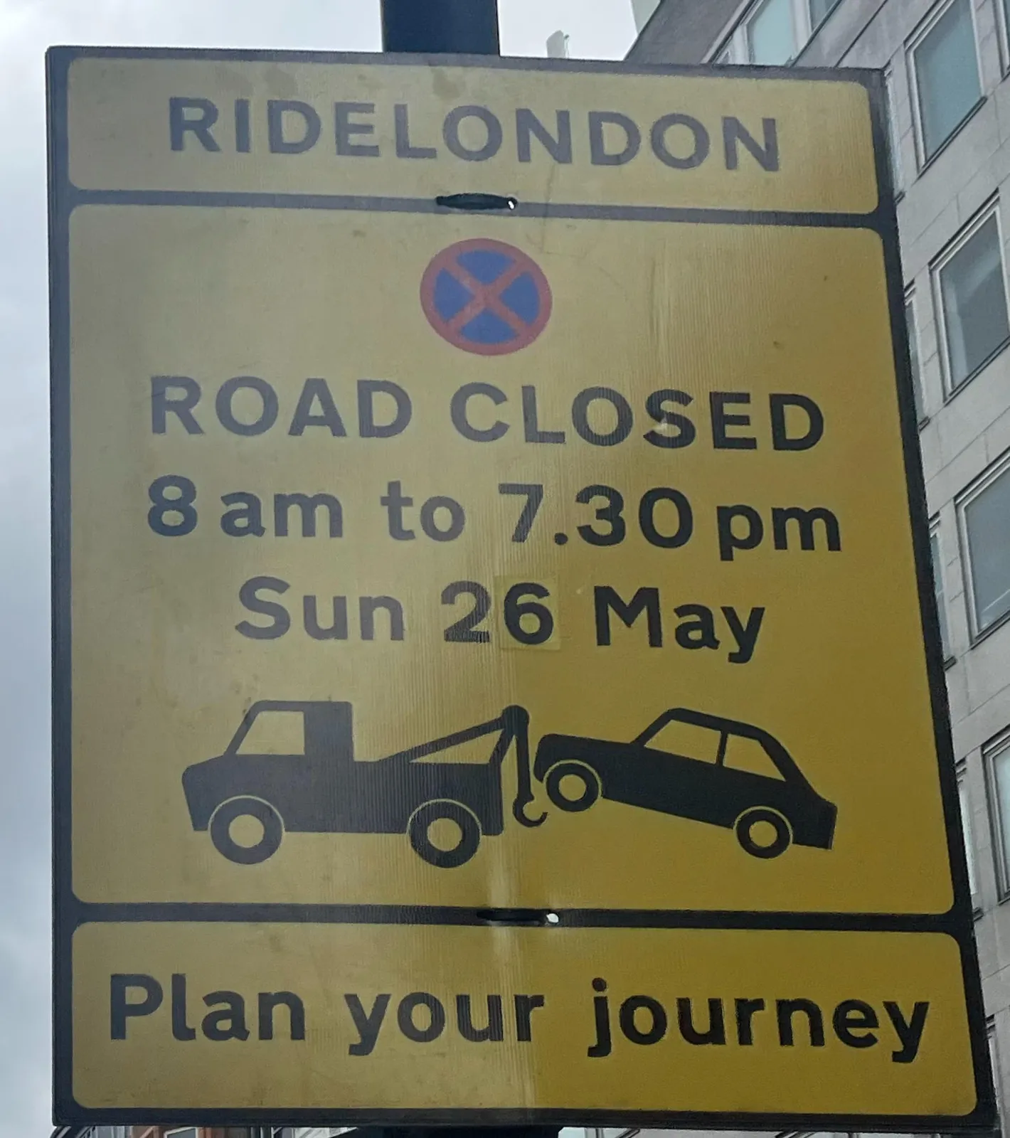 A street sign that says: Road Closed, 8 am to 7.30 pm, Sun 26 May.