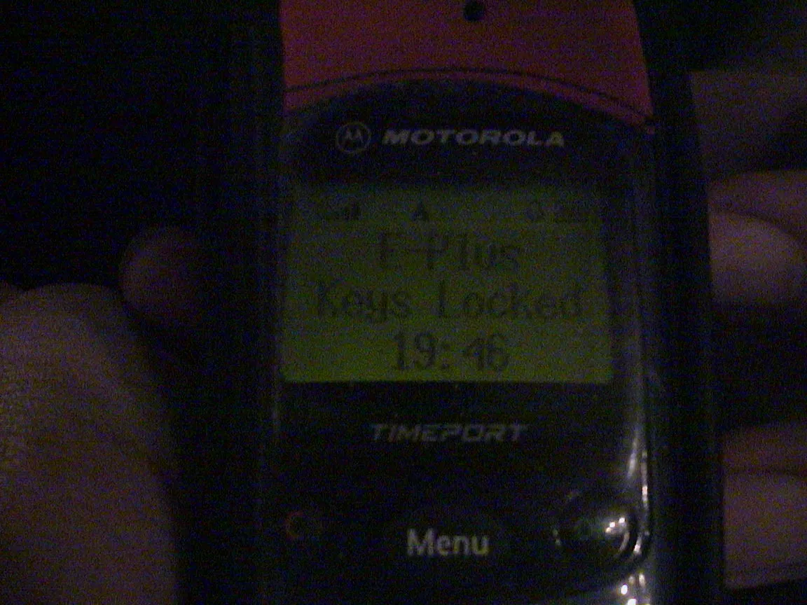 The time on the screen of this old Motorola phone says it is 19:46. It also says E-Plus, Keys locked.