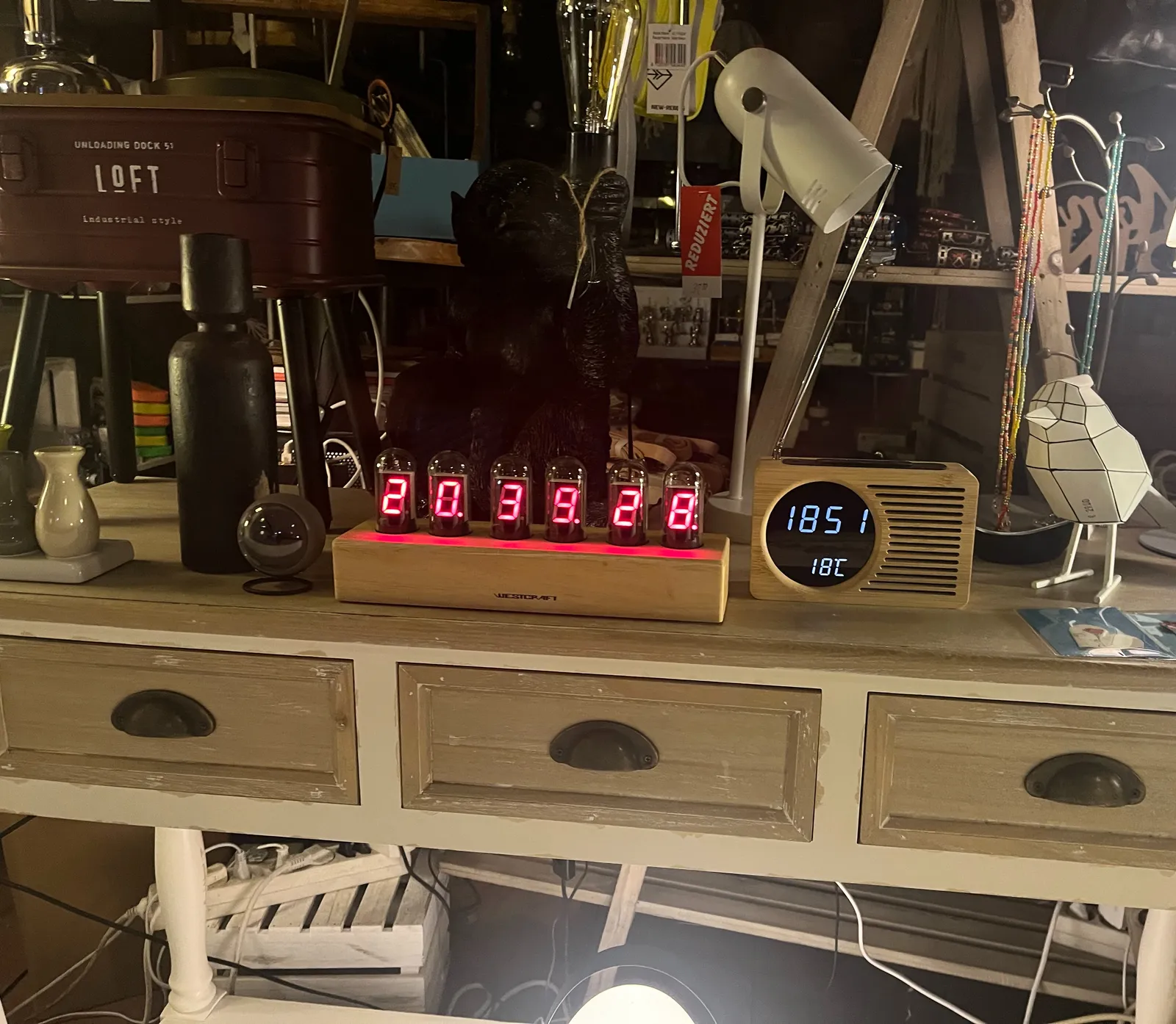All kinds of stuff for sale in this shop. Among the stuff is clock made from valves, you know, the ones you find in certain amplifiers. There are numbers in these valves that read 20.39.28. Next to it is another clock which shows the wrong time.