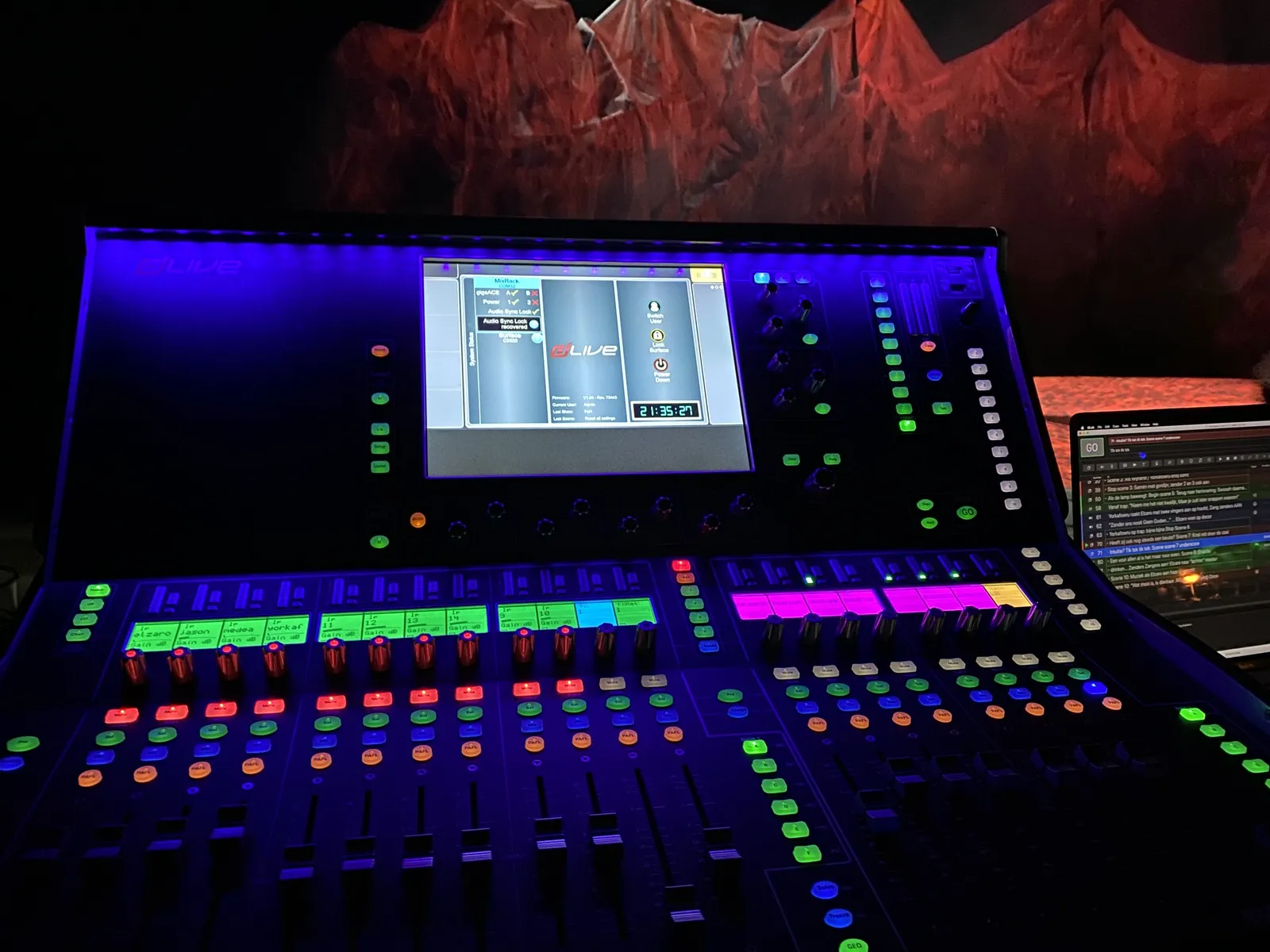 A brightly lit, very colourful panel, with all kinds of knobs and sliders and buttons. There’s a display on it with information. Among this information is the time, which is 21:35