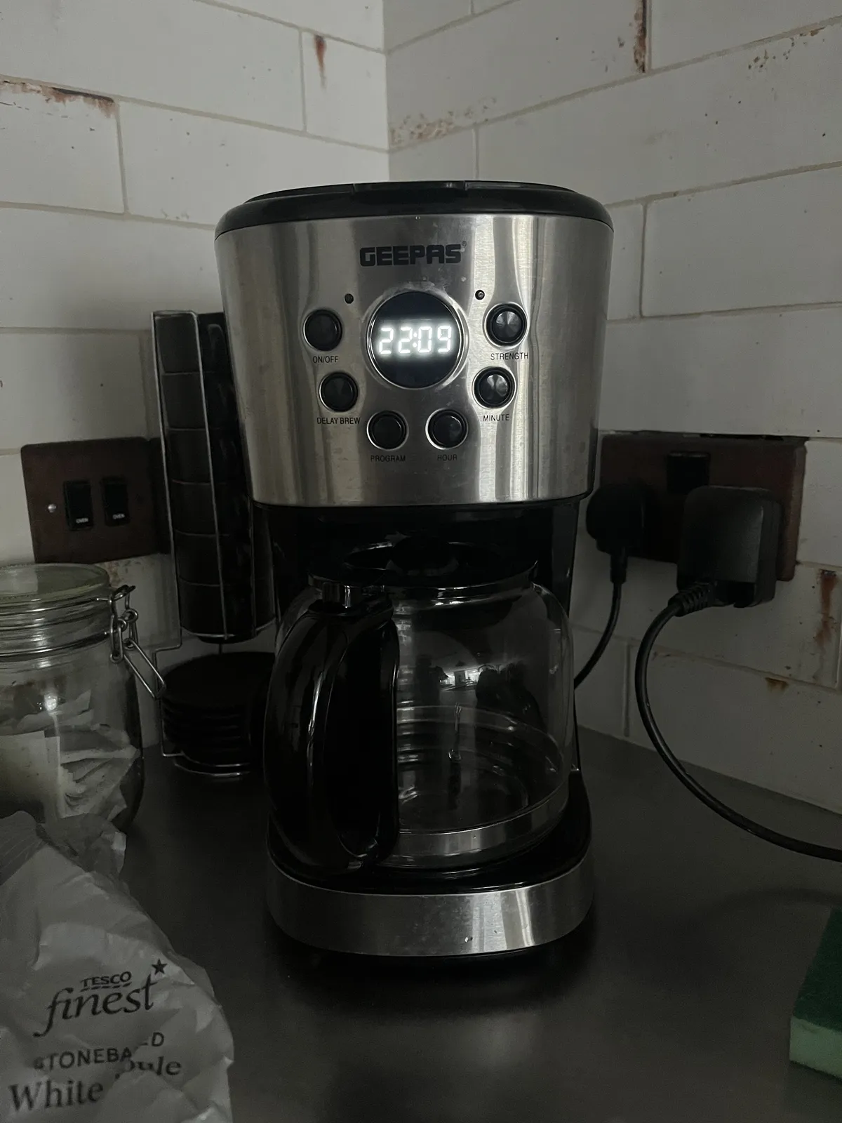 This coffeemachine has a digital clock on it that shows the time as 22:09