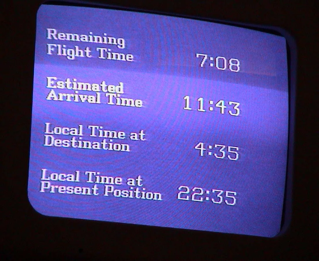There are quite a few timestamps on this display in a plane. Time of arrival, time on destination and the remaining flight time. But the only one that matters is the local time at the present position. Which is 22:35