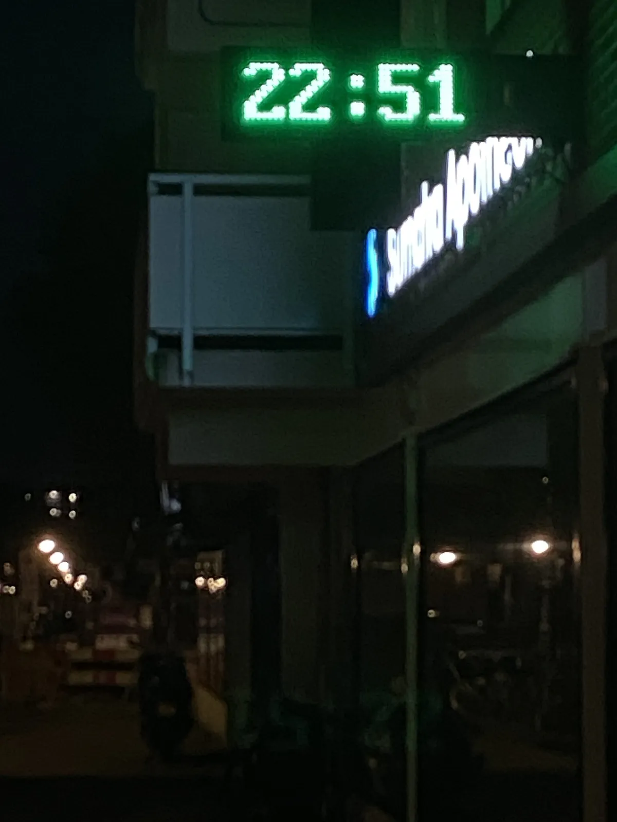A digital clock, at night. It displays the time as 22:51