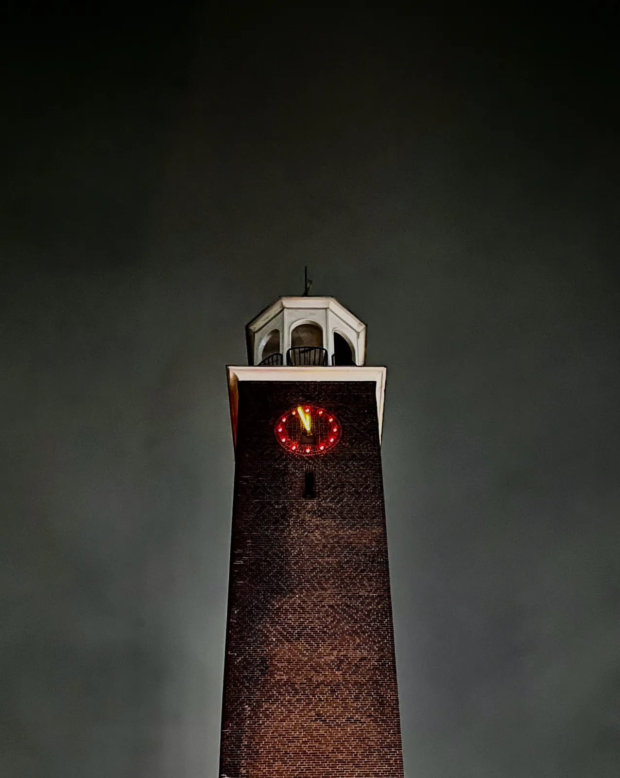 The clock on this church tower points at approximately two minutes before midnight.